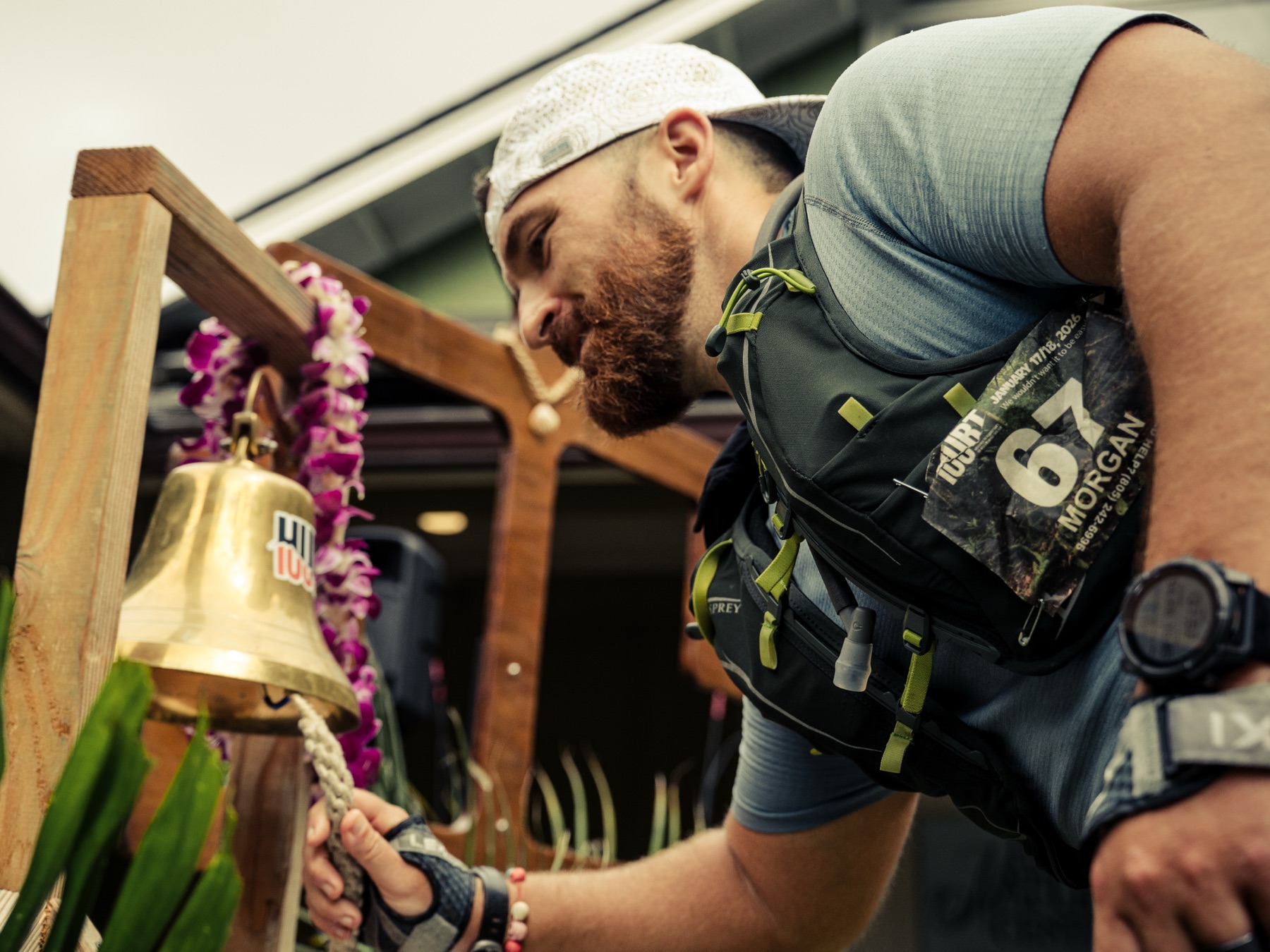 Morgan ringing the finisher bell at the HURT 100 finish line